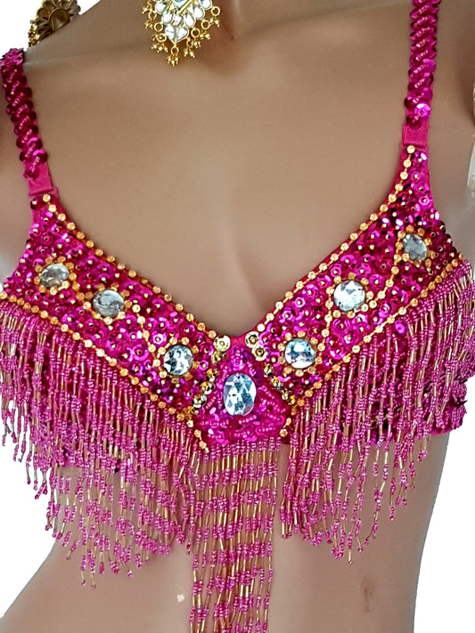 BH in fuchsia met gouden pailletjes en zilveren strasstenen.
