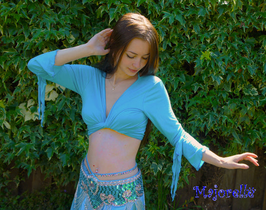 Leuke bind top met vlindermouwtje in turquoise