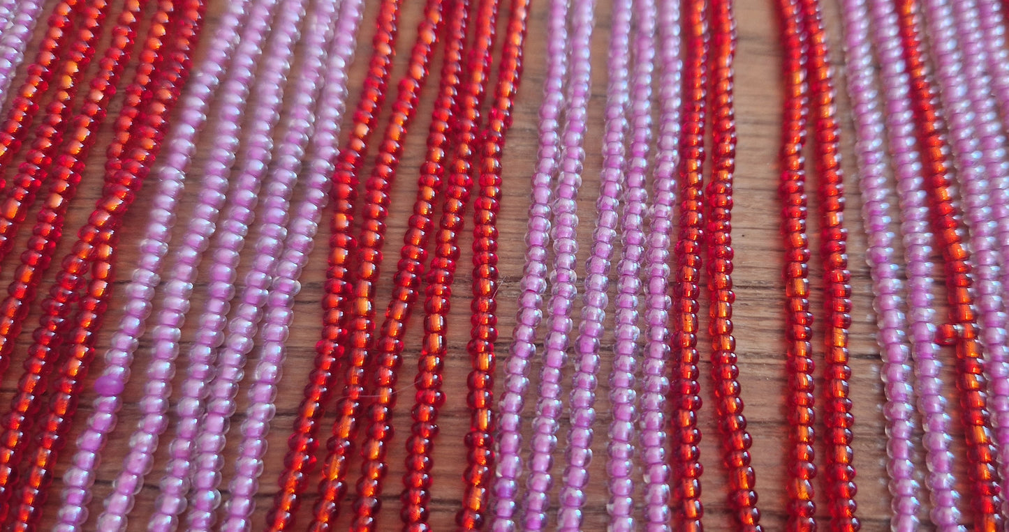 Kralensnoer met slierten rood roze 30cm