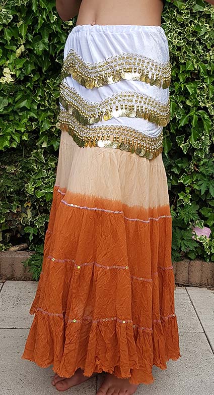 Katoenen rok (100%) met batikverloop in koper.