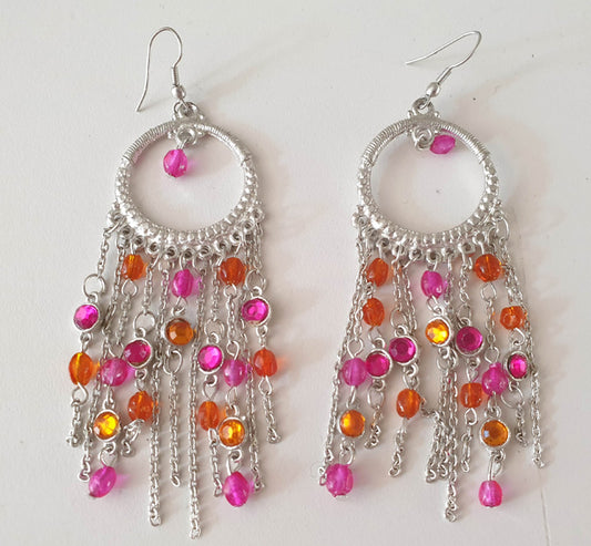 Zilverkleurige oorbellen met fuchsia en oranje steentjes
 
 
 Nikkelvrij
